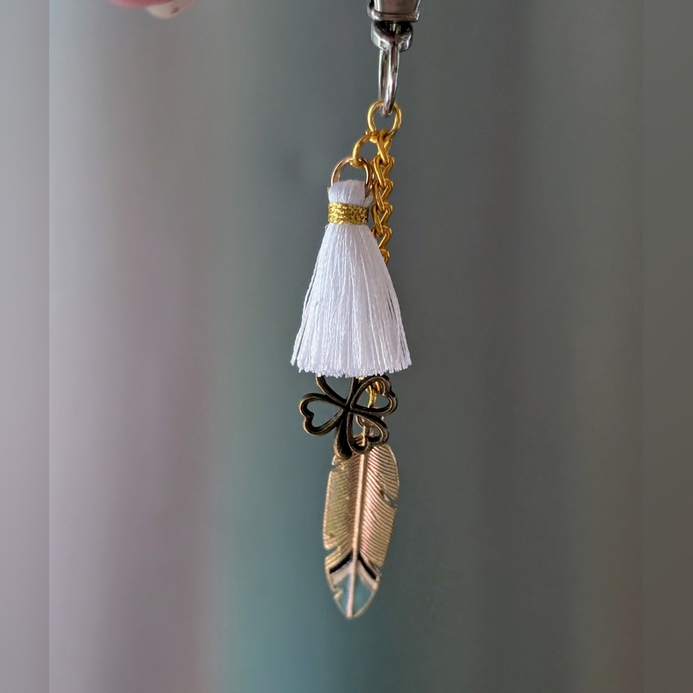 Four Leaf Clover And Feather Bag Charm With Tassel